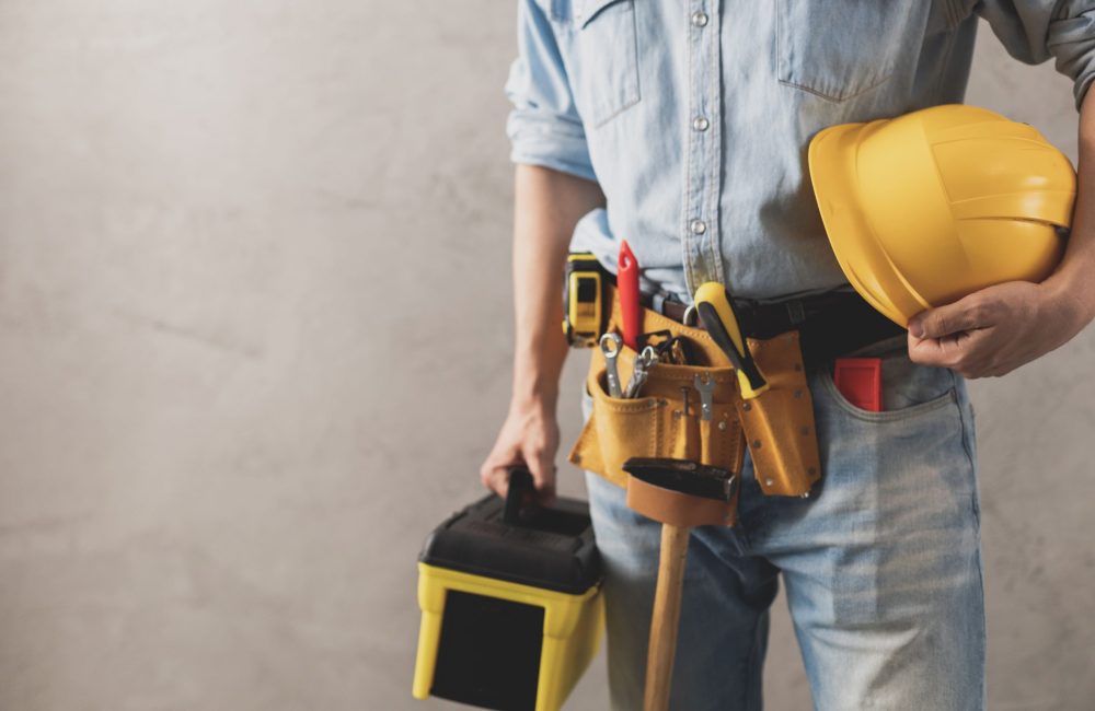 worker-man-holding-construction-helmet-and-toolbox-2024-10-18-05-28-22-utc